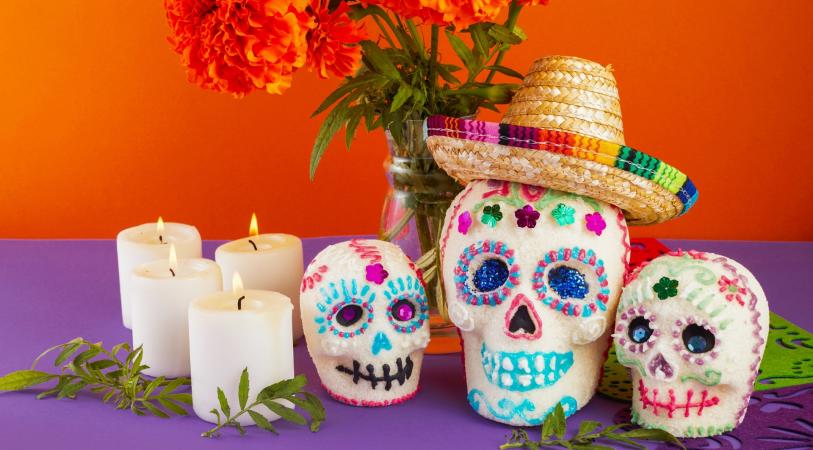 Candy skulls, marigolds and candles celebration day of the dead