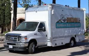 Driver's Side of Burbank Public Library's Bookmobile, shown parked outside Buena Vista Branch Library.
